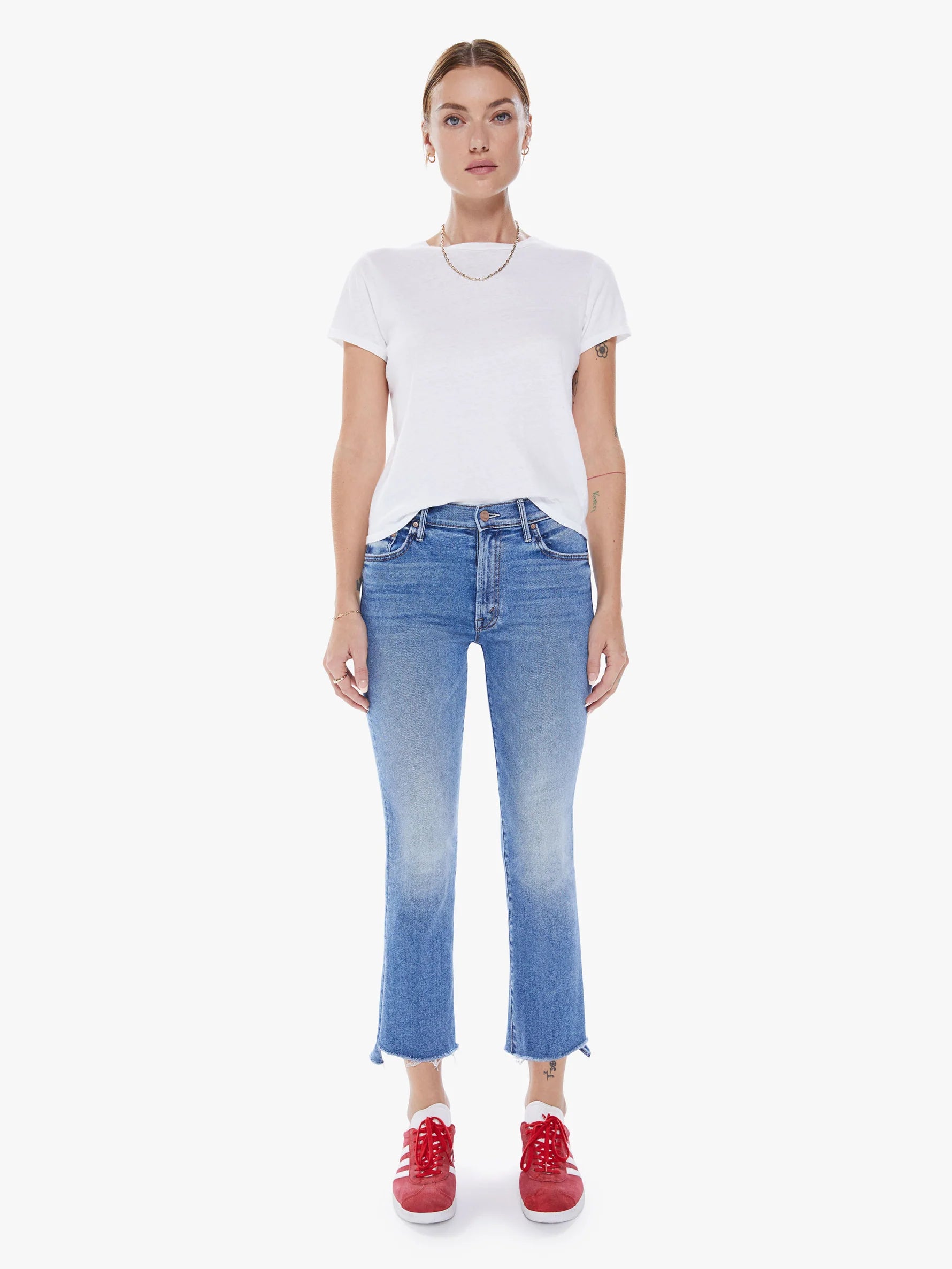 Squeeze the day. This iconic high-waisted bootcut is cropped at the ankle with a frayed step-hem. Cut from stretch denim, Juicin' is a mid-blue wash with whiskering and fading throughout.