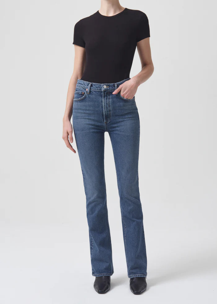 Inspired by our fan-favorite high rise slim but now updated to have a subtle boot at the leg opening. The Nico is our go-anywhere, wear-with-anything fit. Style this waist-cinching pair back to a sleek tee to create an ultra-flattering silhouette.   Crafted in our new Weightless Stretch organic denim and meant for all day wearability.  This fit is true to size.  Closure: Button Fly  Rise: 11 1/4" Inseam: 31"