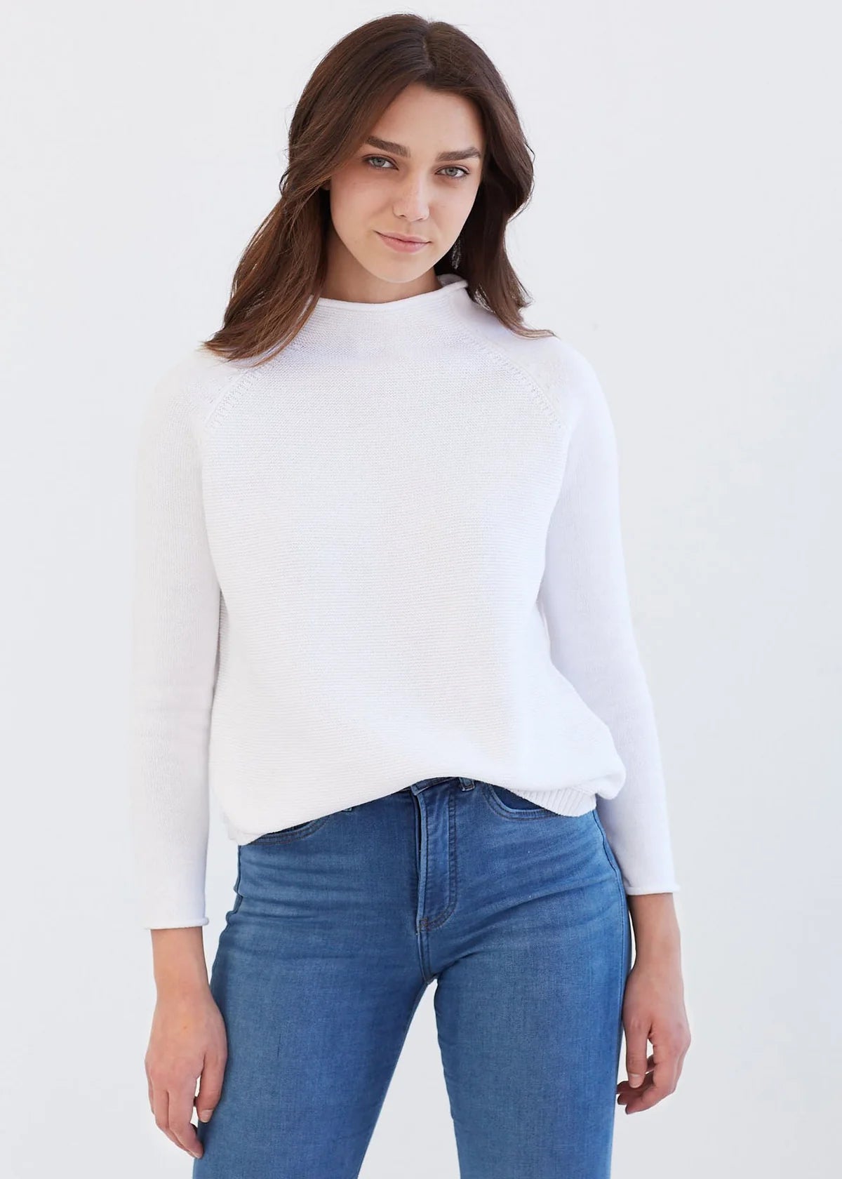 The cotton version of our best-selling cashmere sweater has arrived and we guarantee you'll love it just as much. This mock neck style sweater is just as stylish as it is comfortable - knitted out of a luxe Peruvian cotton that is super soft and perfect for all seasons. Delicate details like the rolled finish at the neck and sleeves will make this your go-to “elevated casual” knit that you reach for over and over again.   Fit Note: Runs true to size, but if you're in between sizes, we recommend sizing up.