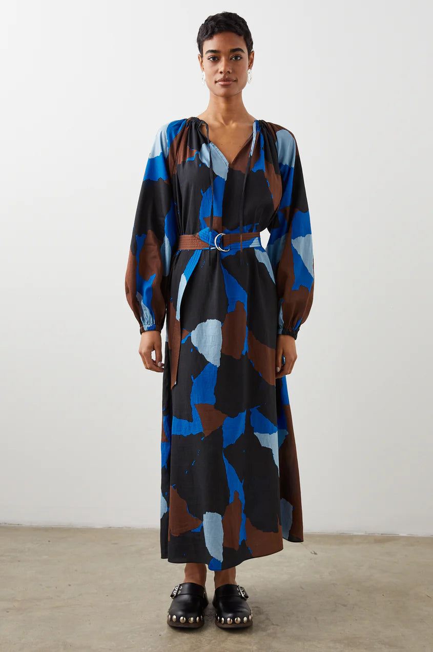 Bring a pop of color into the season with this printed long-sleeve dress. Made from crinkle lyocell, this style boasts adjustable ruching and ties at the collar, belting at the waist, and a flattering midi length. The artistic print mixes cold-weather neutrals and vibrant blues beautifully. 86% Lyocell | 14% Nylon.