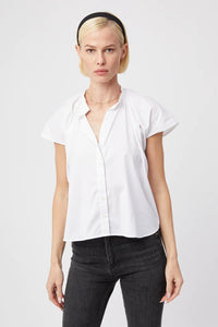 The easiest shirt in your wardrobe. Simple, drapes away from the body, lightweight and airy.  Rochelle Behrens reimagined how shirts should fit and feel. Our patented No Gape® button technology, seamlessly designed into every shirt and shirtdress we design, eliminates blouse gape. Finally say bye bye blouse gape, hello The Shirt.  75% Cotton, 20% Nylon, 5% Stretch Made in Portugal Powered by our patented No Gape® button technology All buttons are tonal and match the color of The Shirt.