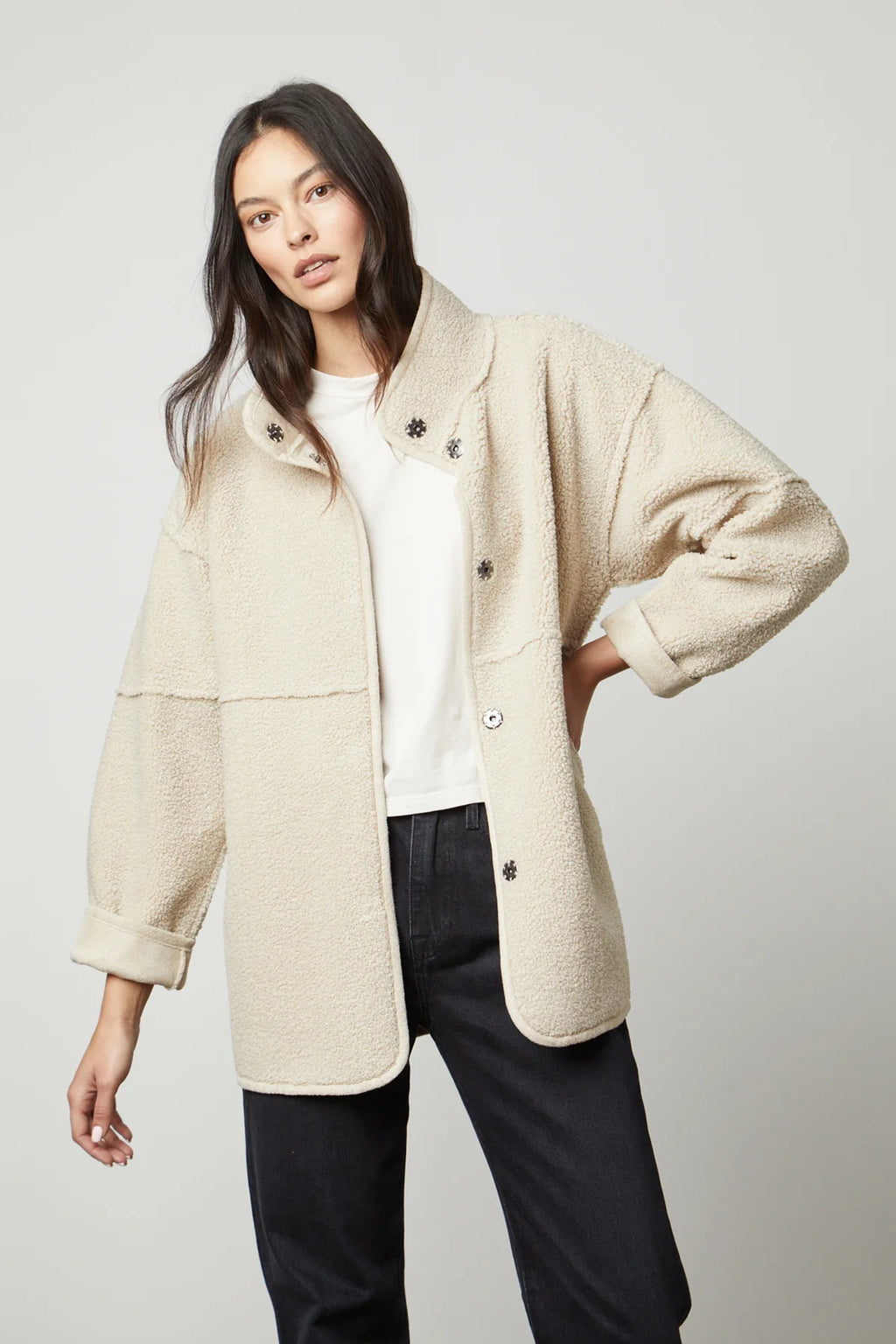 Up your jacket game with this reversible beauty. One side is an eco-chic faux sherpa, while the other side is a faux suede. With a relaxed silhouette that's perfect for layering over a chunky knit, it features slash pockets, popper buttons and a cool stand up collar.
