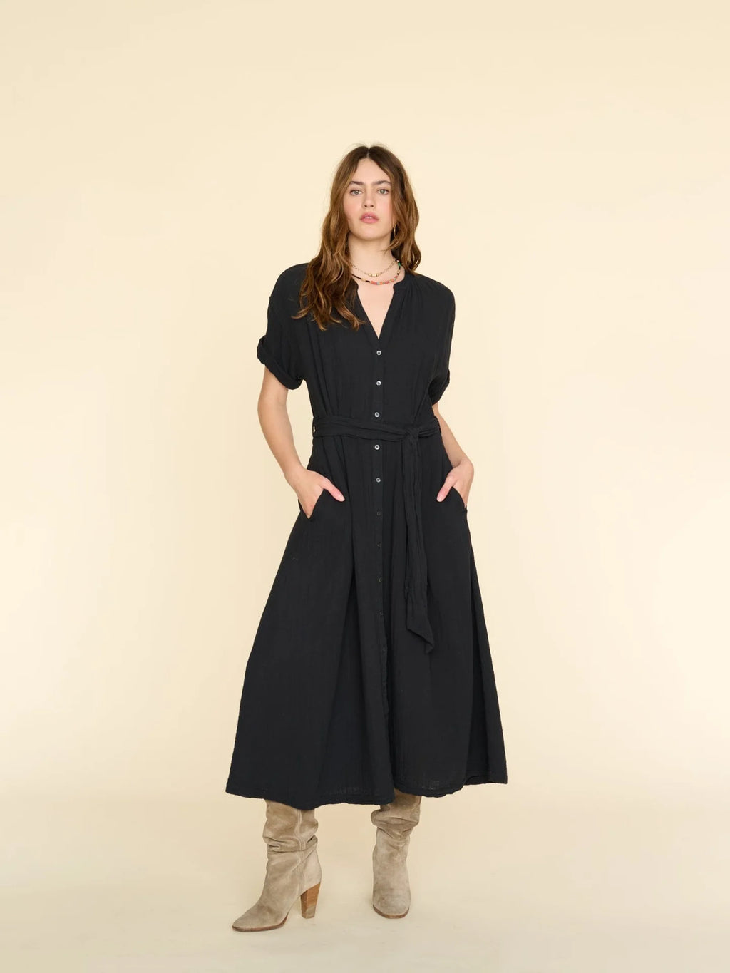 Cate is made in our washed double faced cotton gauze for a soft, gently crinkled feel. This XIRENA favorite has a button-front placket, a-line skirt, side seam pockets, and adjustable tie-belt.